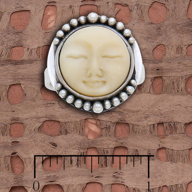 Tagua nut sun face ring with silver-beaded design bezel