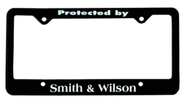 Protected by Smith & Wilson License Plate Frame